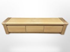 A contemporary oak Moreno Sokkell entertainment low sideboard fitted with two drawers,