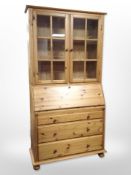 A contemporary pine bureau bookcase,