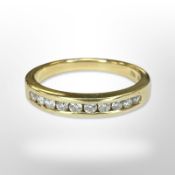 An 18ct yellow gold diamond half eternity ring, size N CONDITION REPORT: 3.8g.
