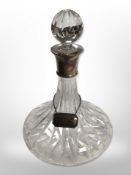 A modern crystal ship's decanter with silver collar and decanter label, height 28cm.