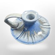 A Shelley blue-glazed porcelain chamber stick, diameter 11cm.