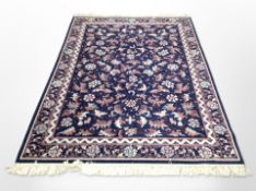 A machine made Persian design rug,
