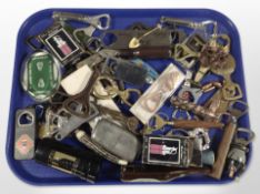 A collection of vintage and modern bottle openers, Guinness items, etc.