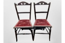 A pair of Edwardian ebonised occasional chairs with ER 1902 carved to the back rests