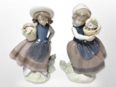 Two Lladró figures of girls carrying baskets of flowers, height 18cm.