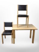 A contemporary oak pull-out dining table,