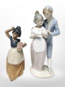 A Nao bisque porcelain figure of a girl carrying a basket of flowers,