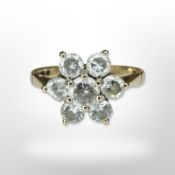 A 9ct yellow gold cluster ring set with synthetic stones,