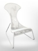 A painted wire metal garden seat