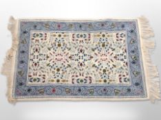 A Tunisian woolen rug on cream ground,