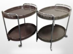 A pair of late 20th century Scandinavian plastic and chrome oval serving trolleys on castors,