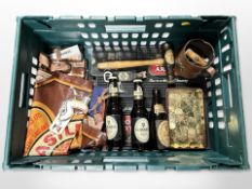 A collection of Breweryana to include Guinness bottles, vintage cork screws, leather tankard,