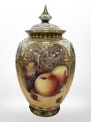 A Royal Worcester urn with cover, hand painted with fruit, black mark to base, numbered 169,