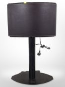 A Bang & Olufsen Beosound 1 curved speaker on speaker stand, with lead.