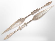 A pair of West African carved wooden dance paddles, length 148cm.