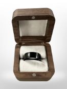 A gent's black titanium ring,