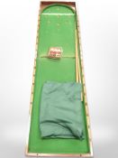 A mahogany cased table top billards game with cues and balls, length approx.