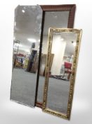 A carved oak-framed mirror, 100cm x 44cm,