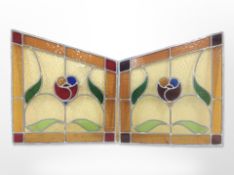 A pair of leaded stained glass panels,