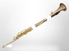 A brass post horn, length 93cm, and three 19th-century brass fire companion pieces.