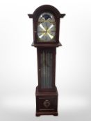 A reproduction mahogany grandmother clock with brass moon phase dial, with pendulum and weights,