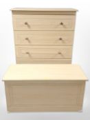A contemporary pine-effect five-drawer chest, 77cm wide x 41cm deep x 115cm high,