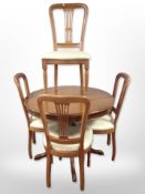 A reproduction circular extending dining table with internal leaf, diameter 98cm (unextended),