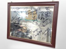 A mahogany-framed Riverside picture mirror signed by various Newcastle United footballers including