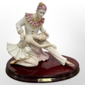 A Capodimonte bisque porcelain figure group,