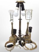 Two pairs of 20th century lamp bases, plus another on lion law feet,