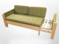 A 20th-century wooden-framed extending day bed, 137cm long x 70cm deep x 65cm high (unextended).