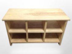 A contemporary pine six-compartment entertainment stand, 81cm wide x 36cm deep x 46cm high.