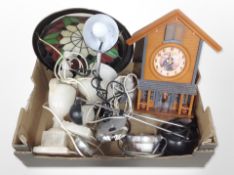 A contemporary wall clock, angle-poise lamp, other lamp bases, etc.