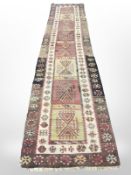 A flat weave kilim runner, 405cm x 85cm.