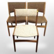 Three 20th-century Scandinavian teak-framed dining chairs.