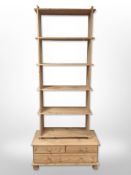 A contemporary pine three-drawer low chest, width 92cm, together with an open bookshelf.