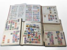 Five albums of stamps.