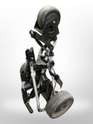 A Powerkaddy EMD electric golf cart, with charger, no battery.