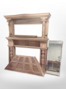 A reproduction carved fire surround with mirror back.