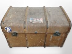 An early 20th-century canvas and wooden-bound trunk, length 84cm.