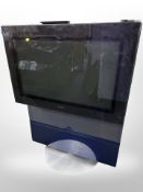 A Bang & Olufsen Beovision 32-inch TV, with lead and remote.
