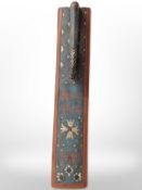 A 19th-century Scandinavian carved and painted pine mangle board, dated 1876, length 61cm.