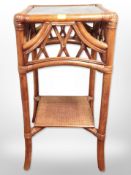 A bamboo and wicker stand, height 63cm.