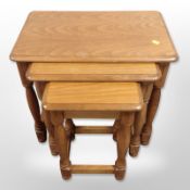 A reproduction nest of three tables, height 52cm.