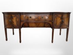 An early 20th century mahogany inverted bowfront serving table, by Gill & Reigate of London,
