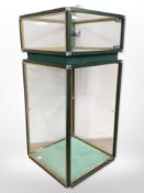 A metal-framed glazed display stand with key, 74cm high x 34cm wide.