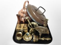 A large copper kettle together with a 19th-century copper pan lid, brass pestle and mortar,
