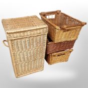 A wicker hamper, height 60cm, and three further baskets.