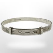 A silver child's expansion bangle, Albert Jackson, Birmingham 1909.