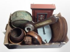 A group of continental wooden wares including teak dinner plates, miniature painted pine cabinet,